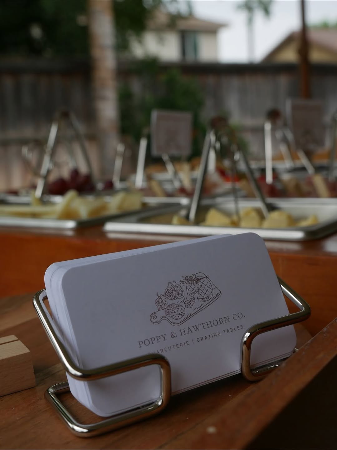 Poppy & Hawthorn business cards at a grazing event