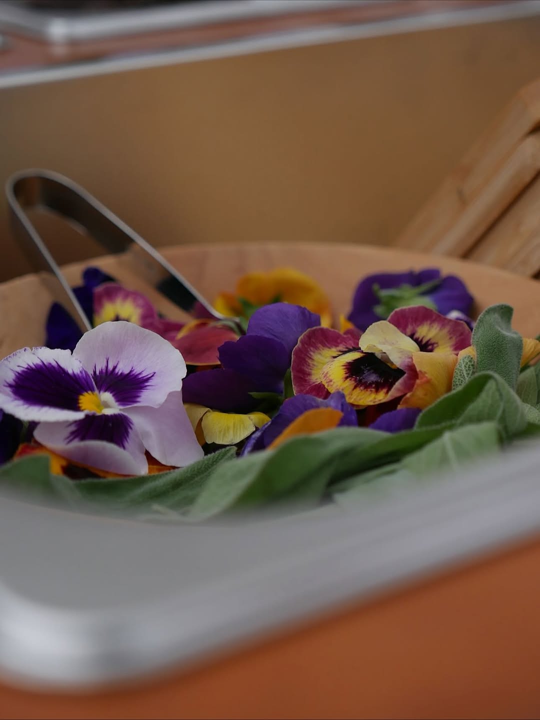 Edible flowers and herbs arranged for garnishing